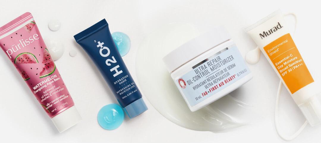 Four moisturizers from various brands swatched on white background Desktop