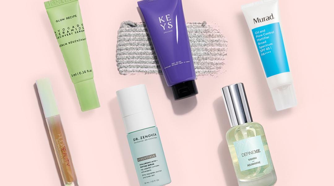 Makeup and skincare products swatched on light pink background Desktop