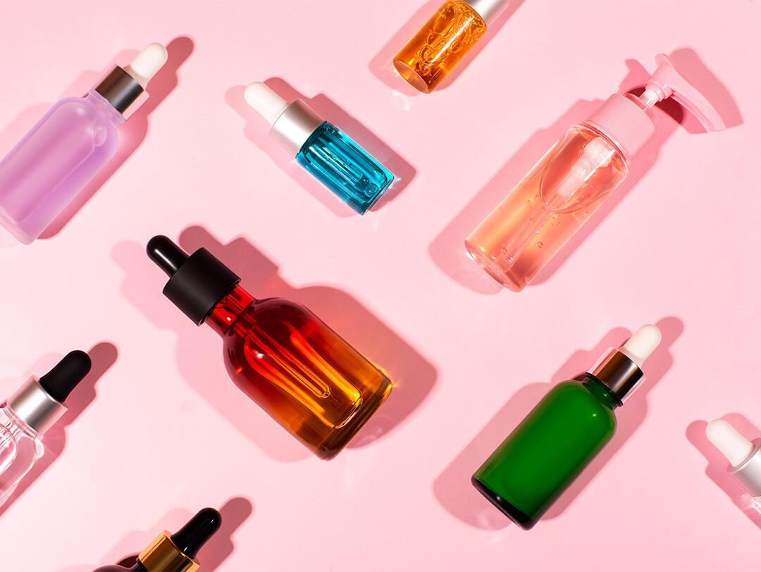 Image of bottles and jars of different colors and shapes with liquid Desktop