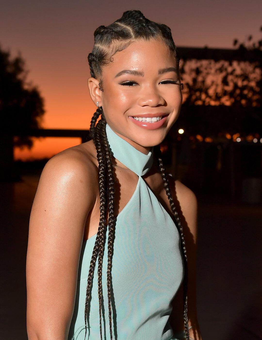 A smiling Storm Reid rocking a goddess braids hairstyle Desktop