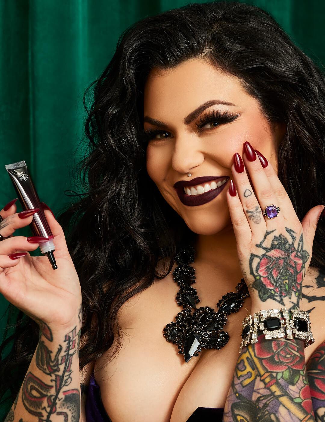 Bailey Sarian applying KVD BEAUTY Modcon Liquid-Gel Blush on her cheek Mobile