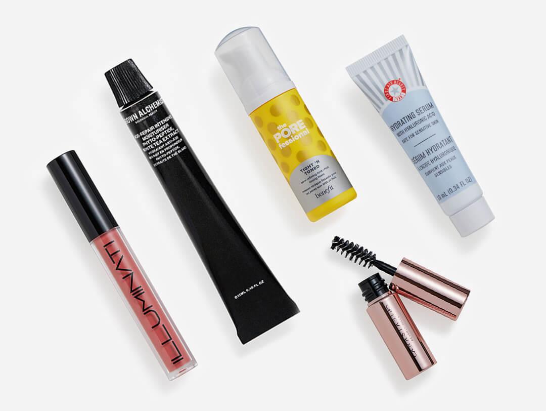 Makeup, skincare, and beauty products from the March 2023 IPSY Glam Bag on white background Desktop