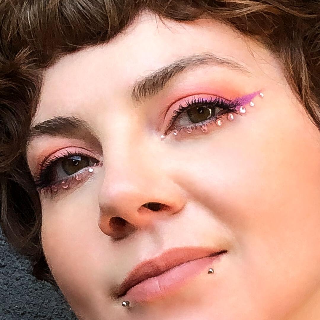 Close-up image of Kirsten Colemen's pink eyeshadow and rhinestones makeup look Mobile