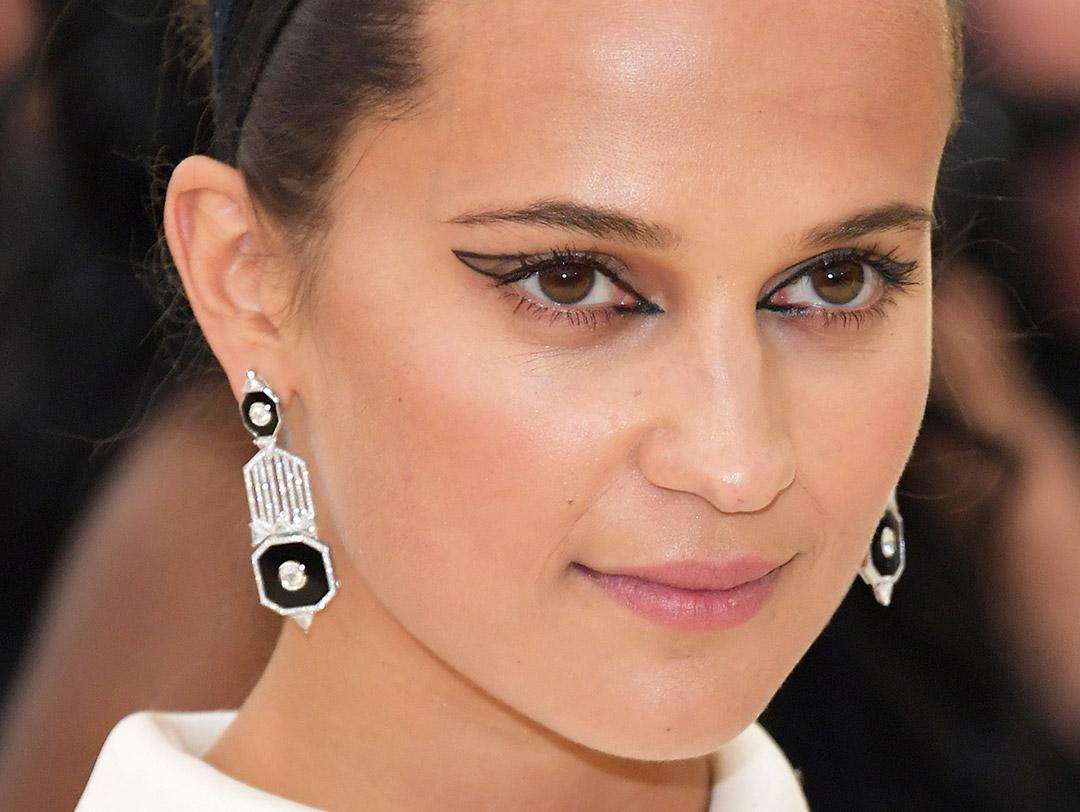 A photo of Alicia Vikander with a graphic eyeliner outline Desktop