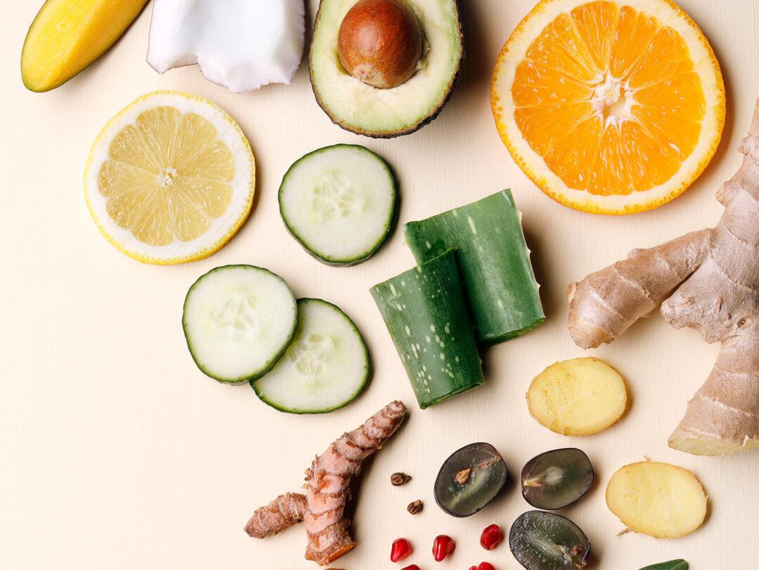 A flatlay shot of different natural ingredients for hair mask on a beige background Desktop