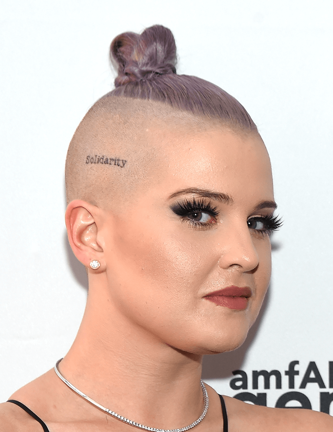 Kelly Osbourne with a lavender undercut with top knot hairstyle side-eyeing Desktop