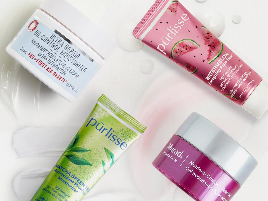 Four oil-free moisturizers from various brands swatched on white background Desktop