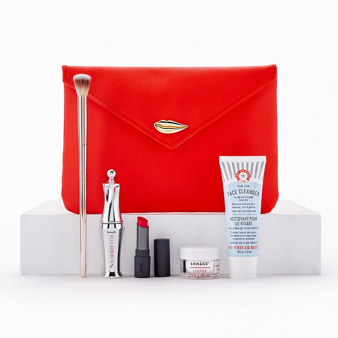 February 2021 Glam Bag and skincare and makeup products and tools on white background Desktop
