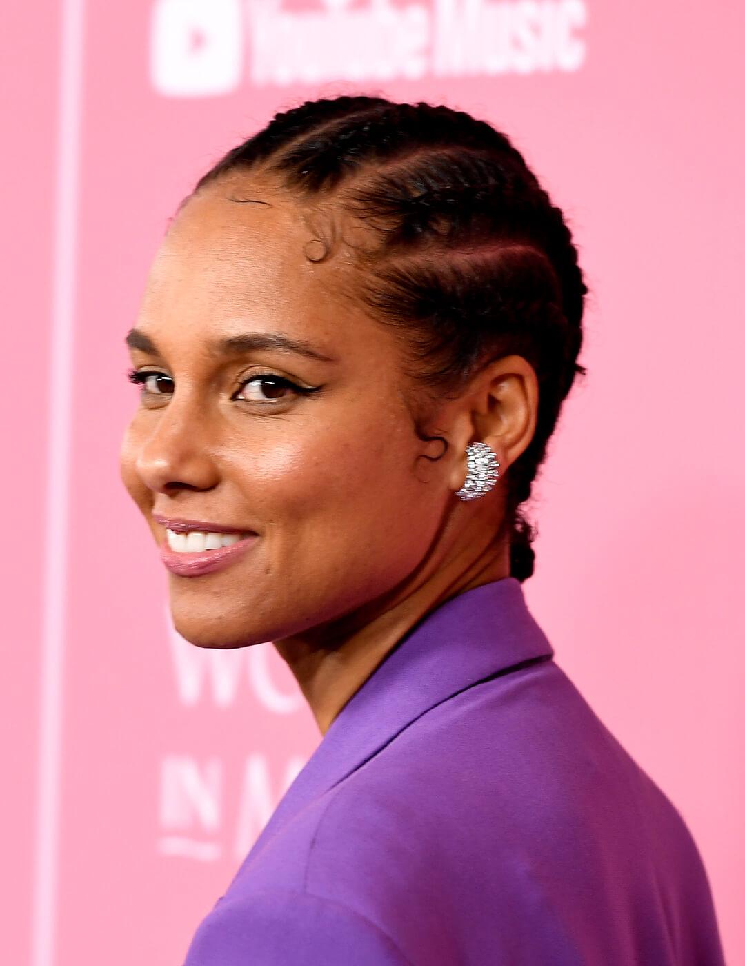 Alicia Keys wearing a cornrows hairstyle and a purple suit Desktop