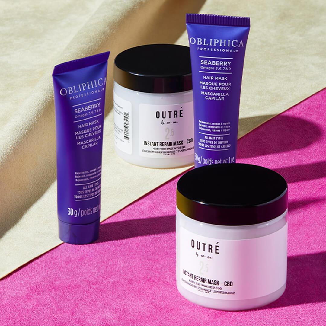 Two pots of OUTRÉ BY USE ME Instant Repair Mask + CBD and two tubes of OBLIPHICA PROFESSIONAL Seaberry Hair Mask on fuchsia and cream textile Desktop