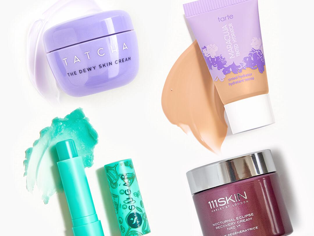 TATCHA The Dewy Skin Cream, SUGAR COSMETICS Tipsy Lips Moisturizing Balm in Mojito, TARTE Maracuja Tinted Hydrator, and 111SKIN Nocturnal Eclipse Recovery Cream swatched on white background Desktop