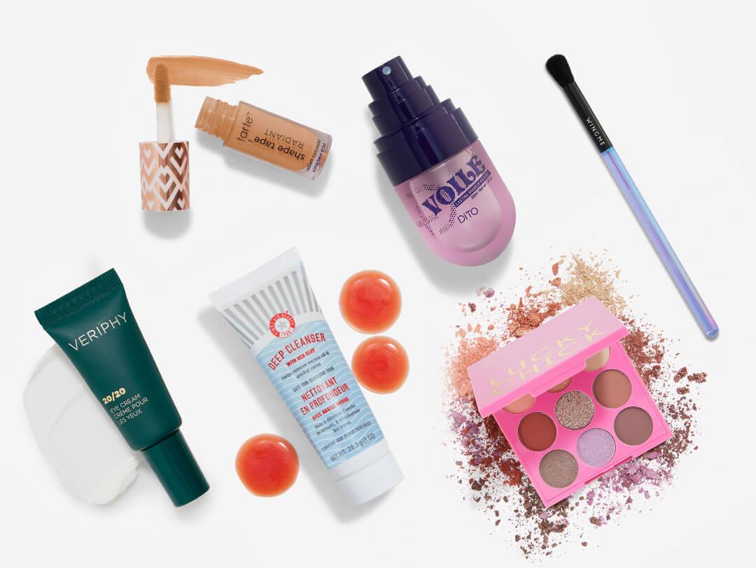 Makeup and skincare beauty products from the January 2024 IPSY Glam Bag on white background Desktop