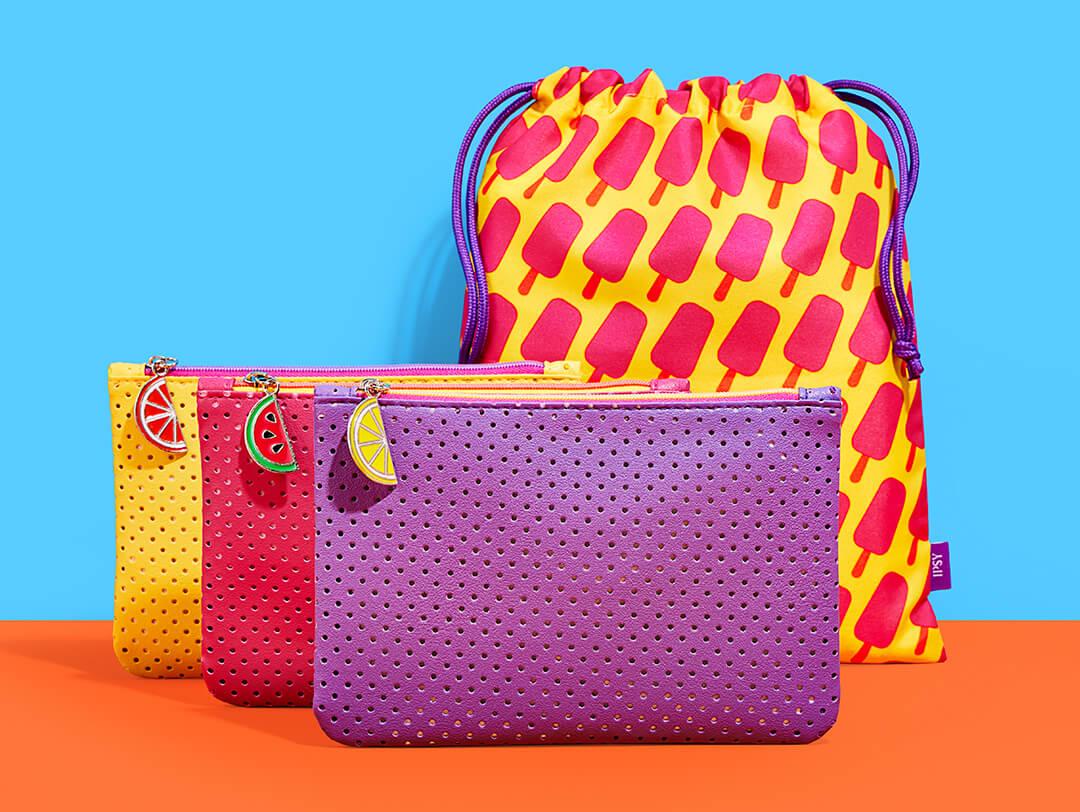 June 2022 Glam Bag and Glam Bag Plus bags on blue and orange background Desktop