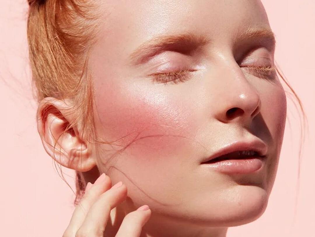 Close-up of a beautiful, young woman with a clean, bold blush makeup look Desktop