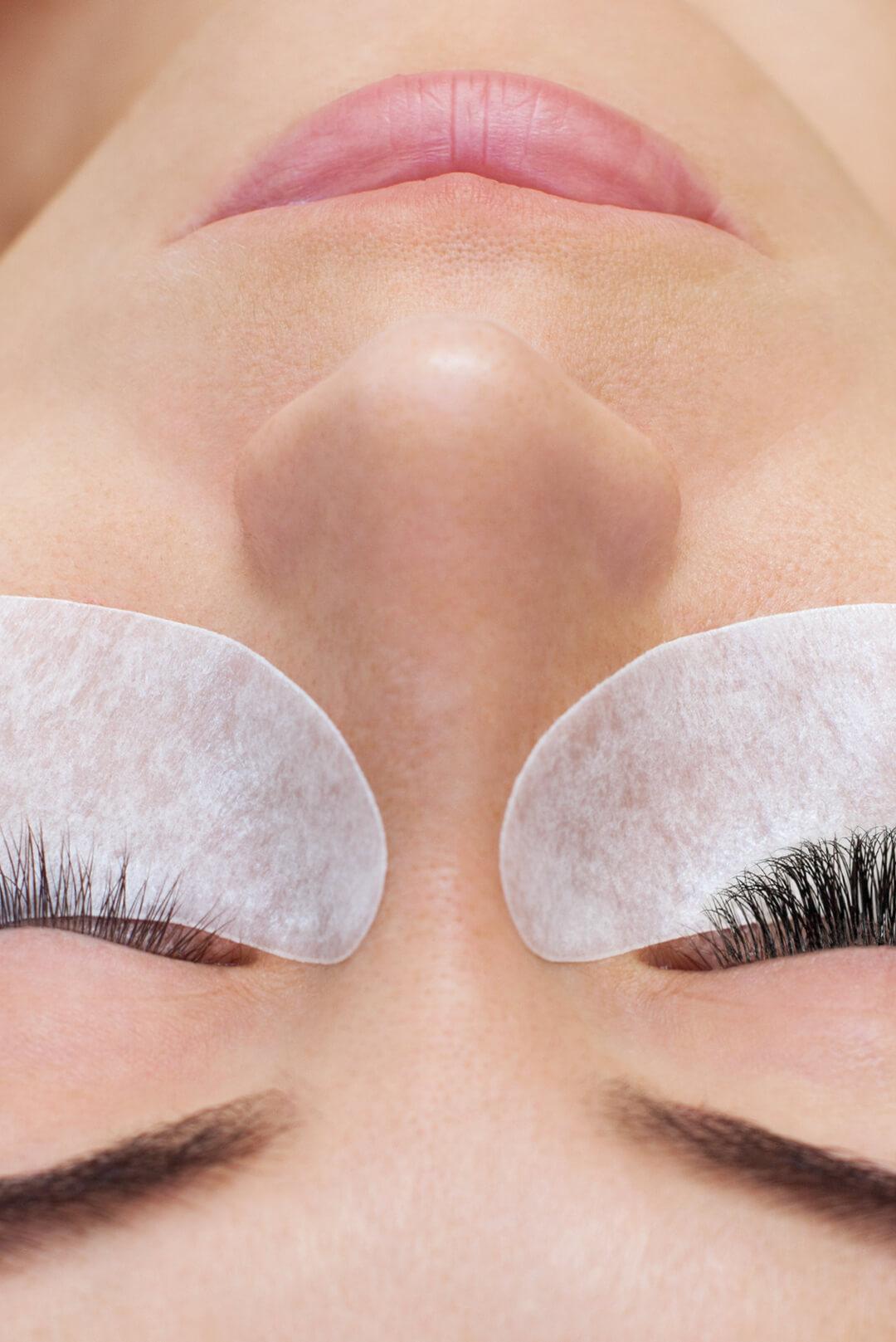 A closeup photo of a model with long lashes in a beauty salon Desktop