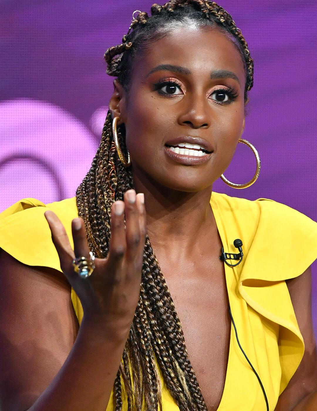 A photo of Issa Rae with blonde streaks and box braids Desktop