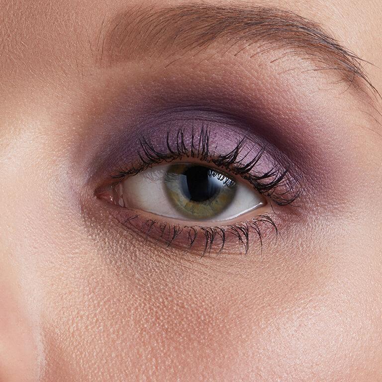 A closeup image of Hazel Graye's eye with a purple eyeshadow Desktop