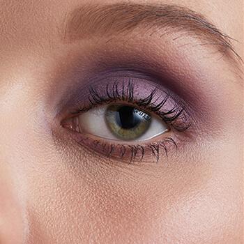A closeup image of Hazel Graye's eye with a purple eyeshadow Mobile