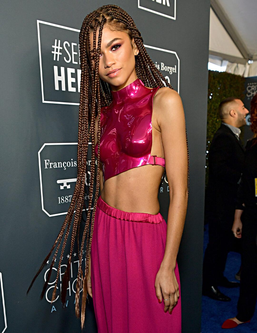 Zendaya in a red dress rocking a very long box braid hairstyle Mobile