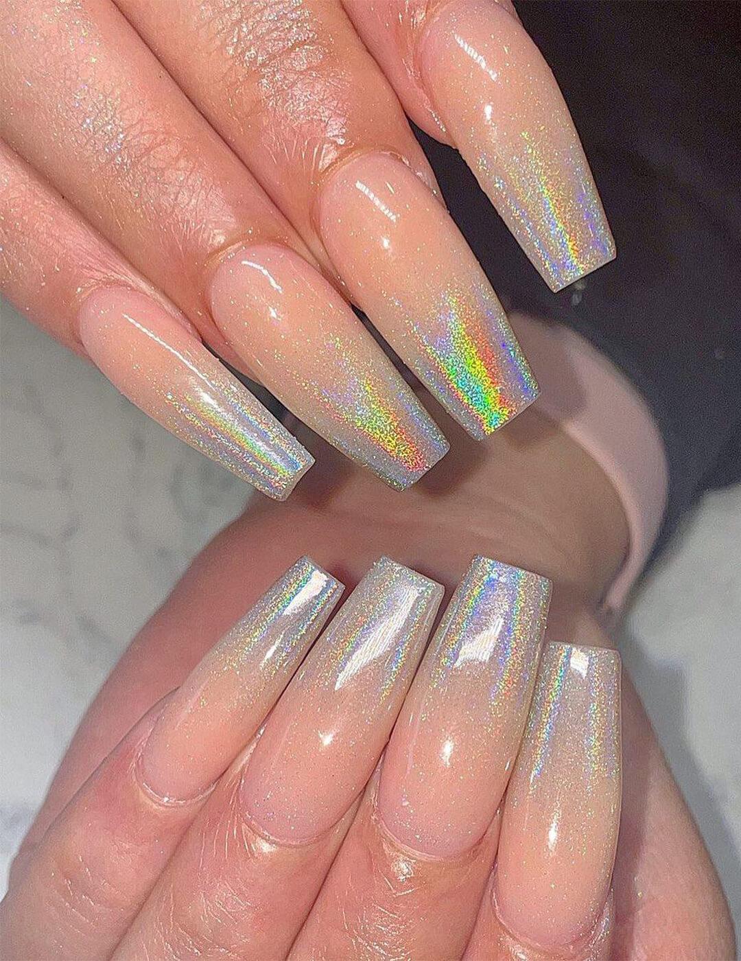 Close-up of woman's holographic ombré nail art Mobile