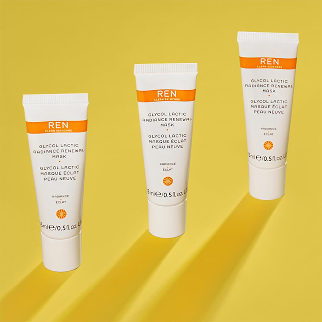 Three tubes of REN CLEAN SKINCARE Glycol Lactic Radiance Renewal Mask arranged on yellow background Mobile