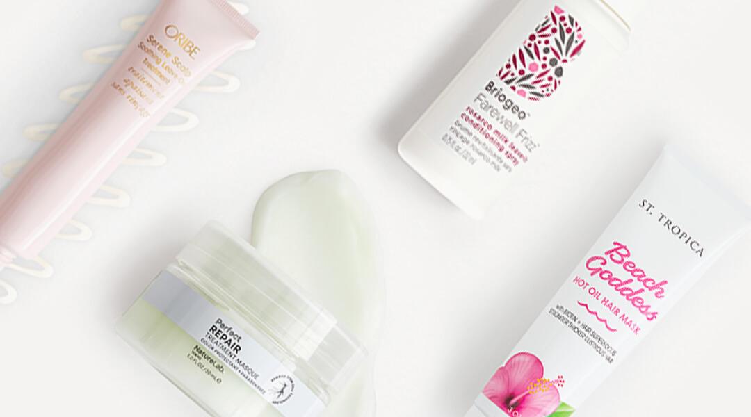 Natural hair care products swatched on white background Desktop