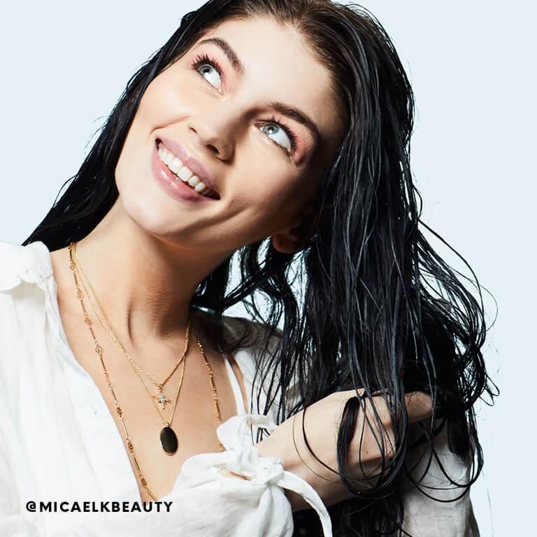 Micaela Klein works leave-in conditioner through her hair. Desktop