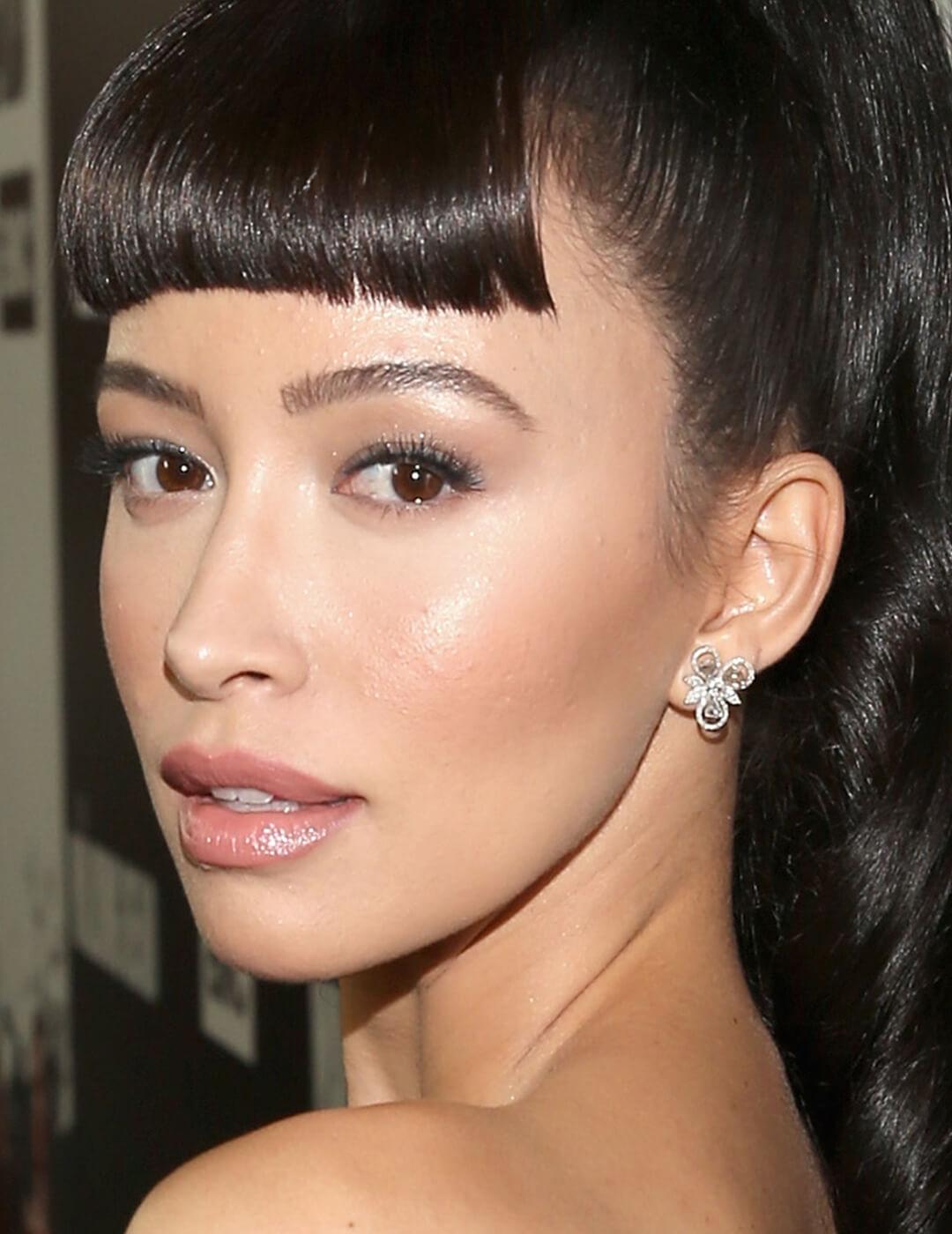 Close-up of a glowing Christian Serratos Mobile