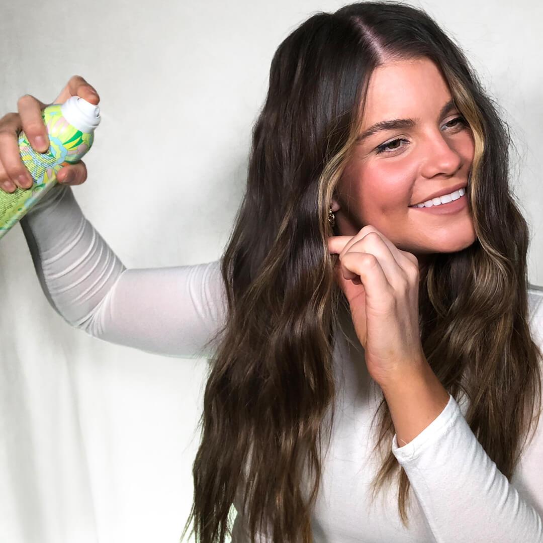 Image of Melissa Hurkman using hairspray on her hair Mobile