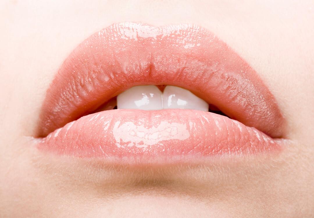 Close-up of a girl's glossy lips Mobile