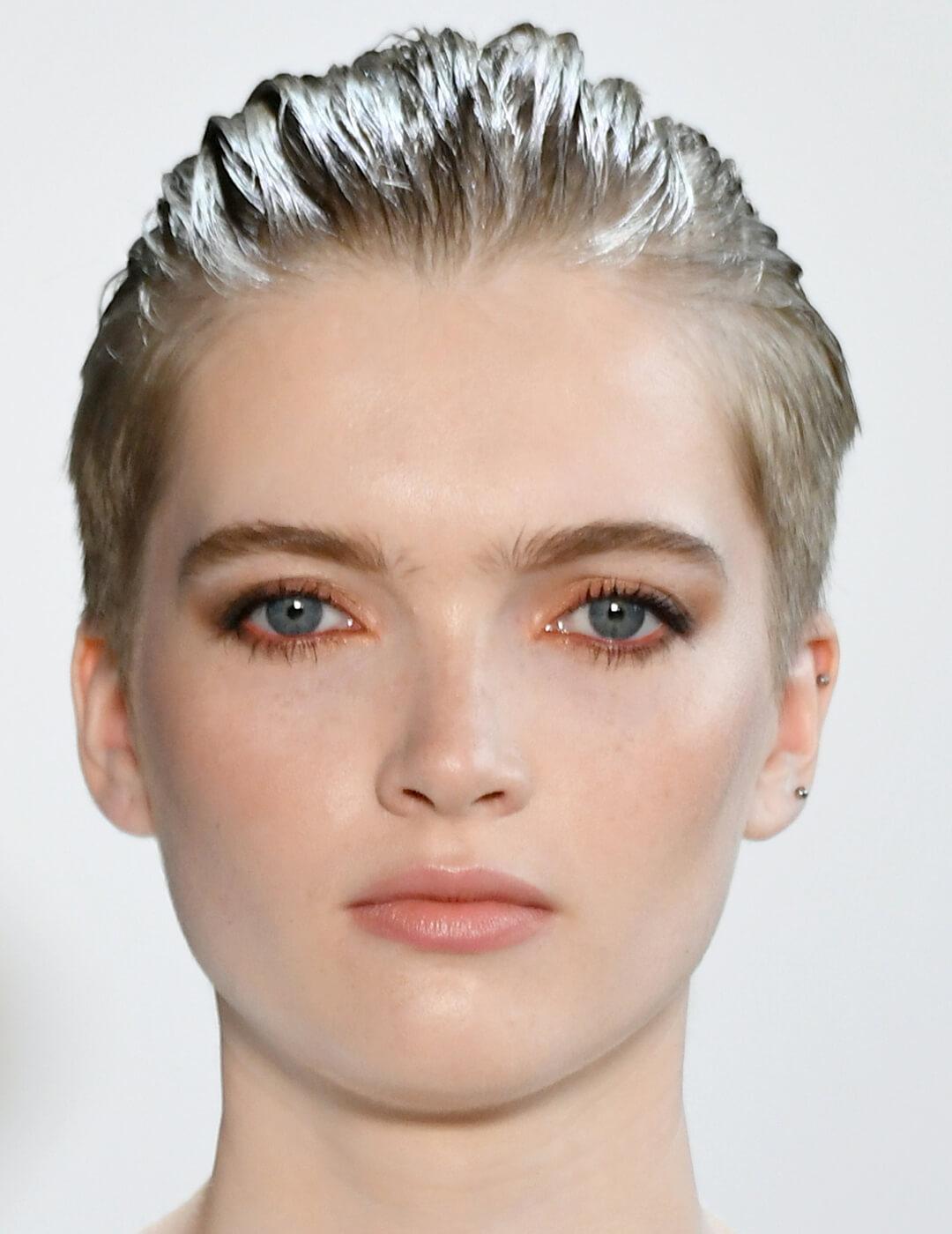 A photo of Ruth Bell with her hair slicked back Desktop