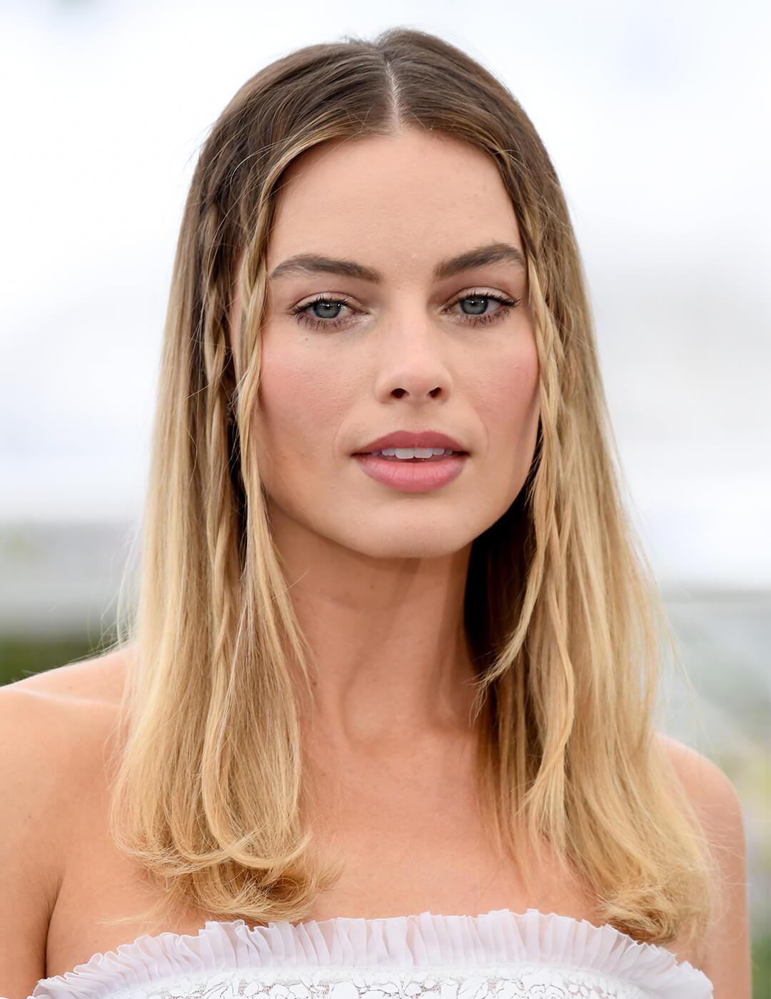 Margot Robbie rocking a boho-inpsired hairstyle at the beach Mobile