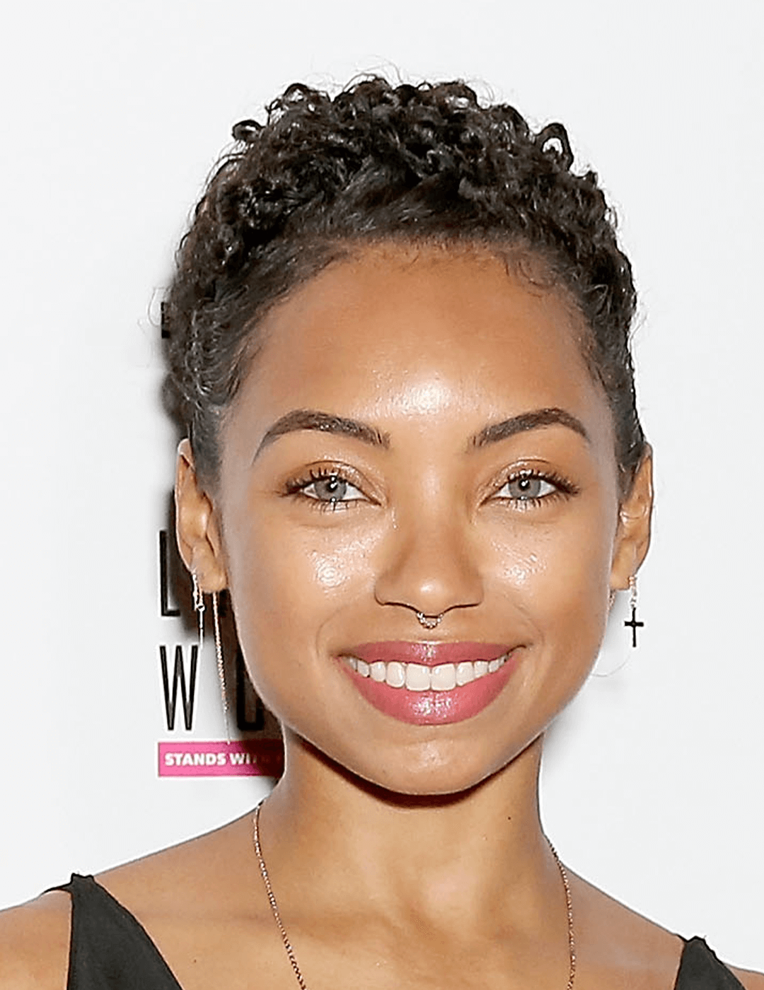 Actress Logan Browning sporting a no-makeup makeup look and curly pixie hairstyle Desktop