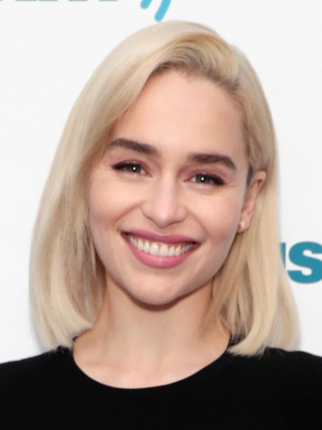 Emilia Clarke smiling and rocking a blunt lob hairstyle Desktop