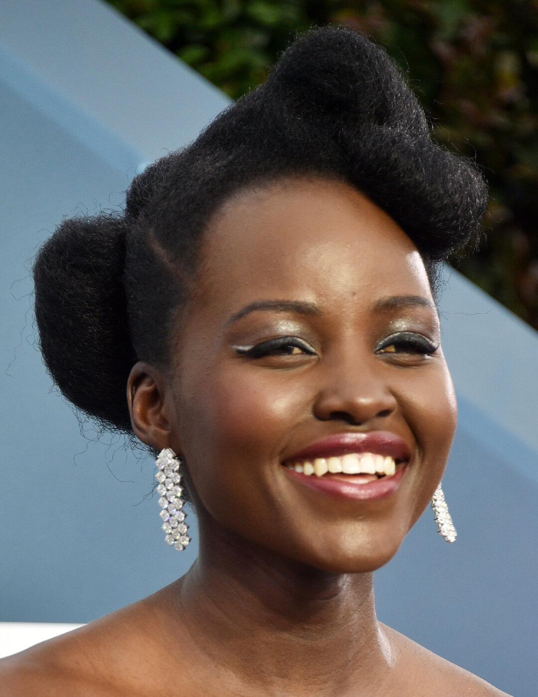 Lupita Nyong'o rocking a glamorous look paired with an updo hairstyle Desktop