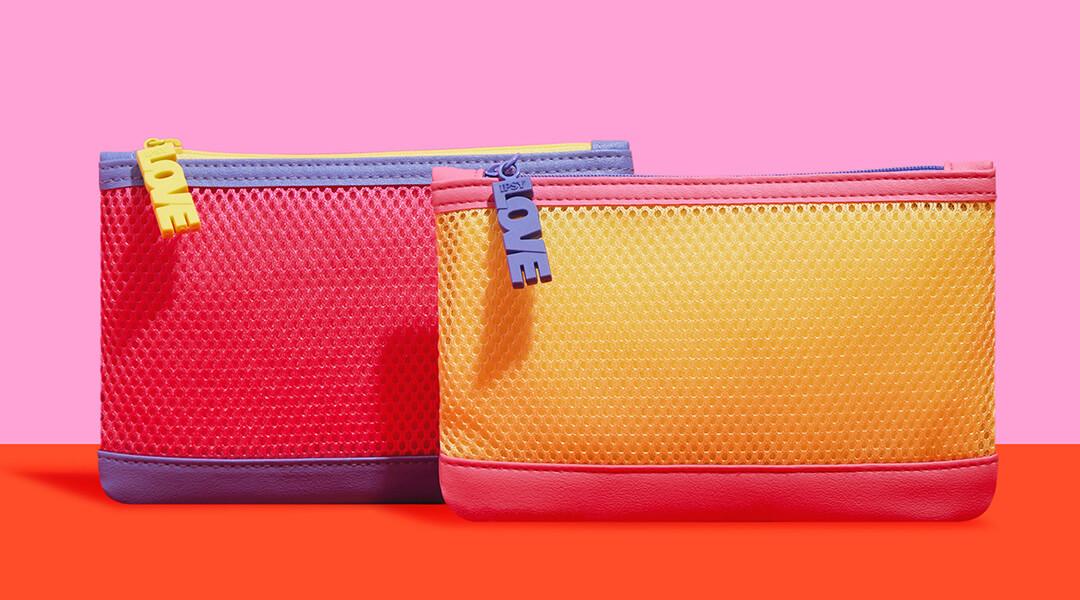 June 2023 IPSY Glam Bags on pink and orange background Desktop