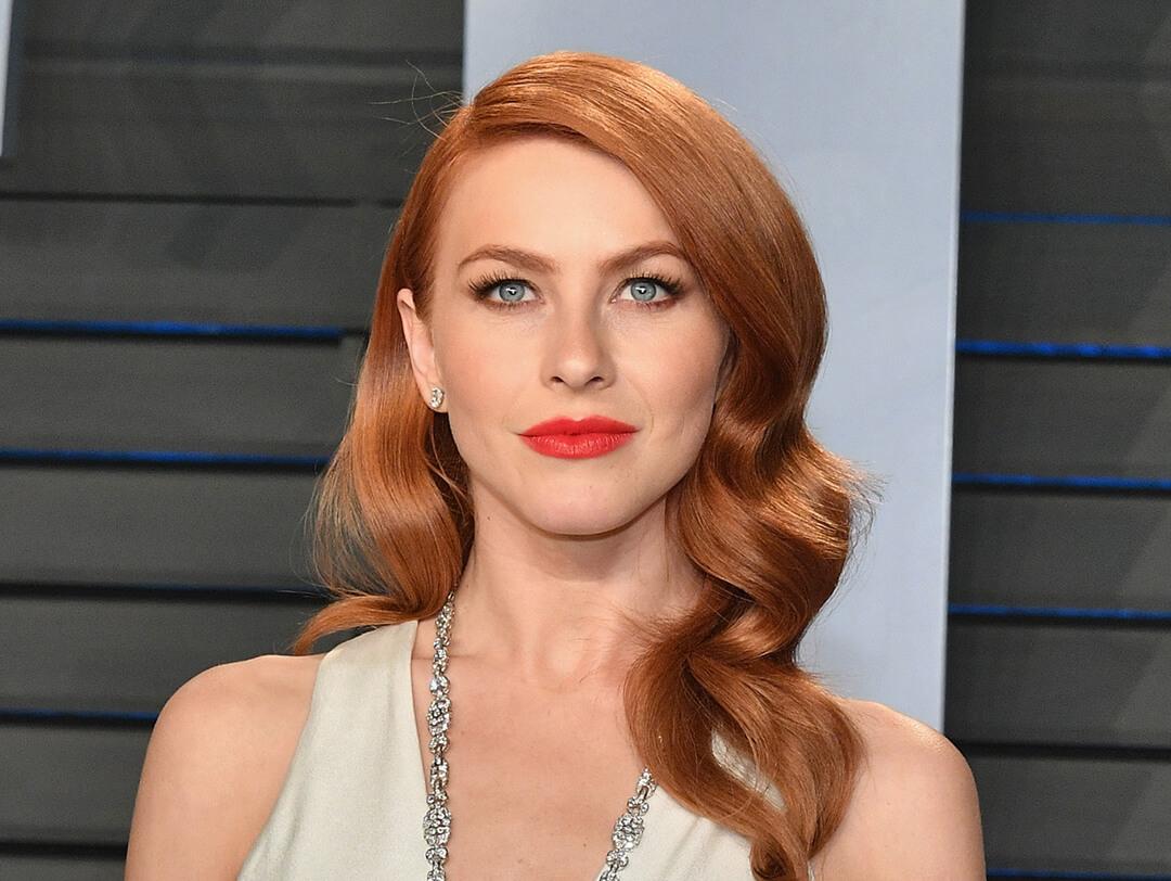 A photo of Julianne Hough with a deep copper hair and red lipstick wearing a white dress Desktop