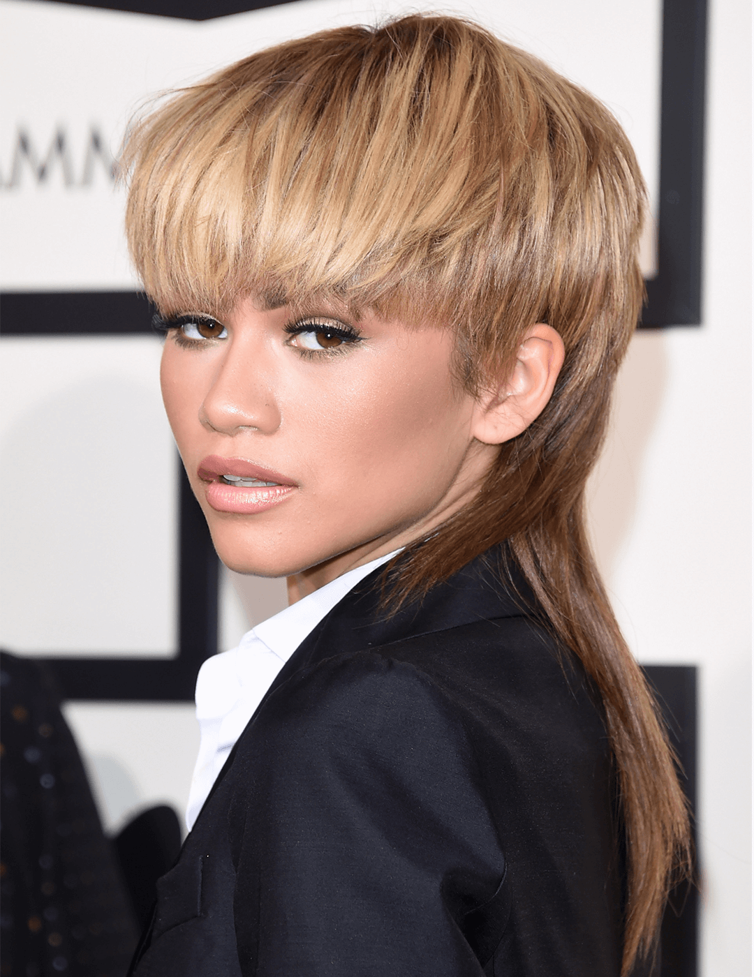 Zendaya rocking a mullet hairstyle and black suit Desktop