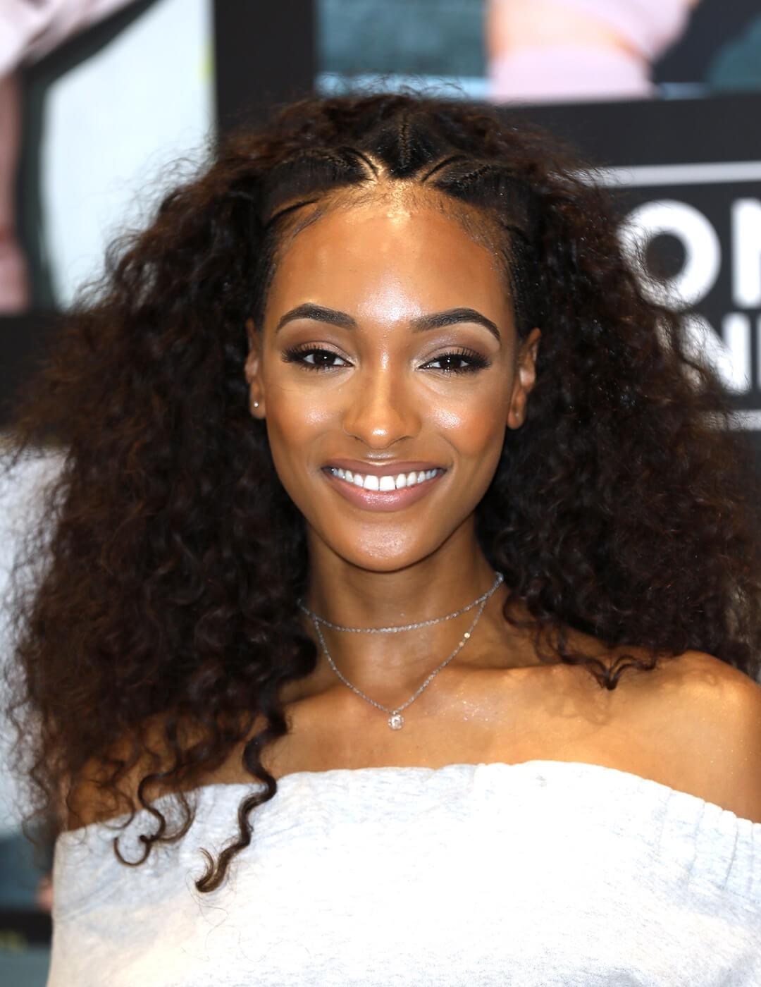 Jourdan Dunn in a white dress rocking her textured curly hair Mobile