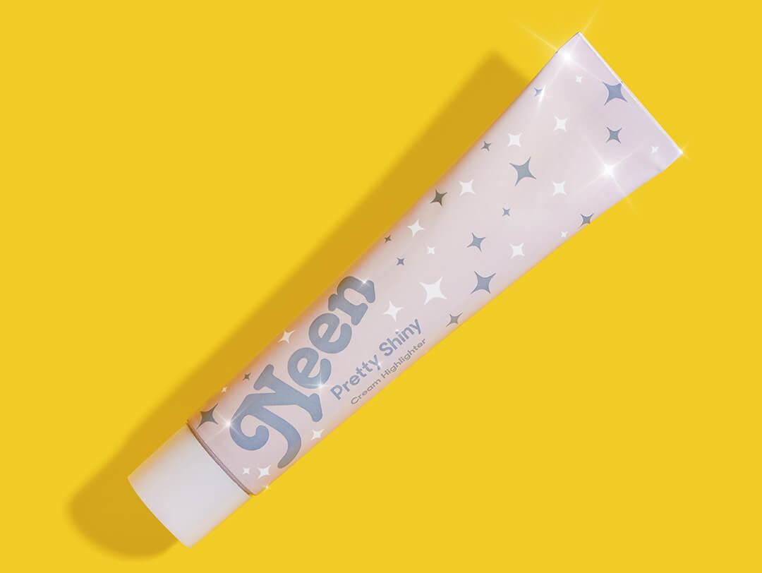 NEEN Pretty Shiny Highlighter in Metta on yellow background Desktop