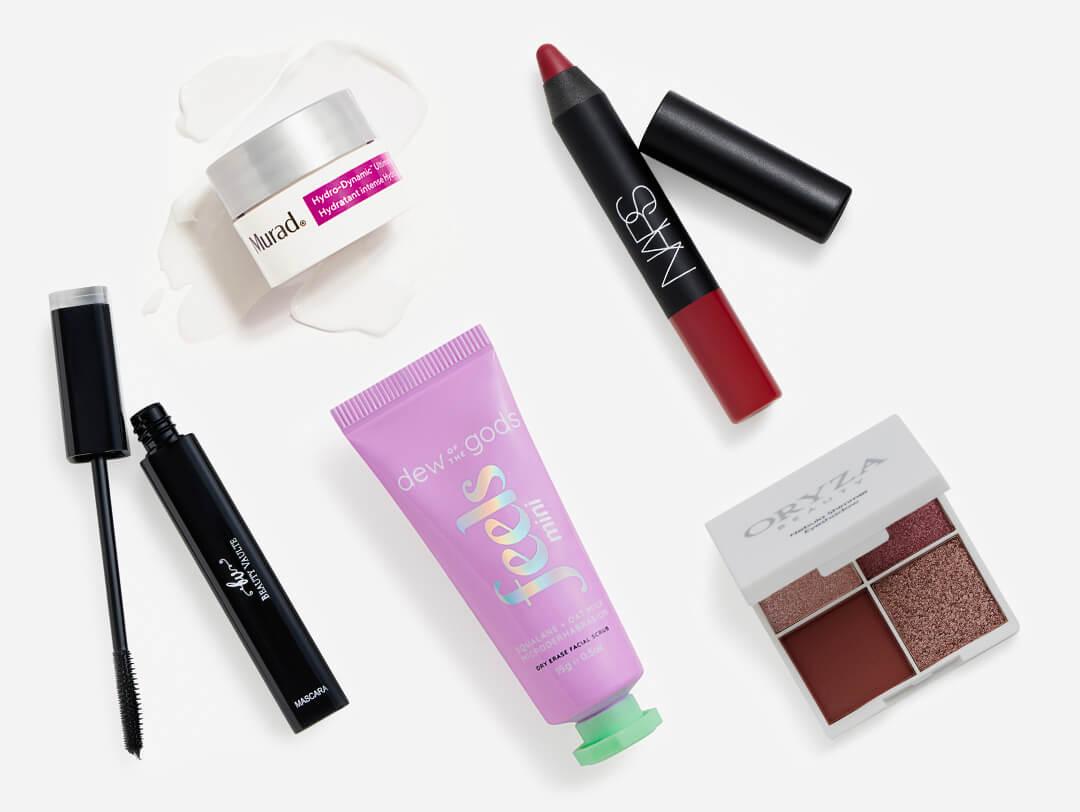 Makeup, skincare, and beauty products from the January 2023 IPSY Glam Bag on white background Desktop