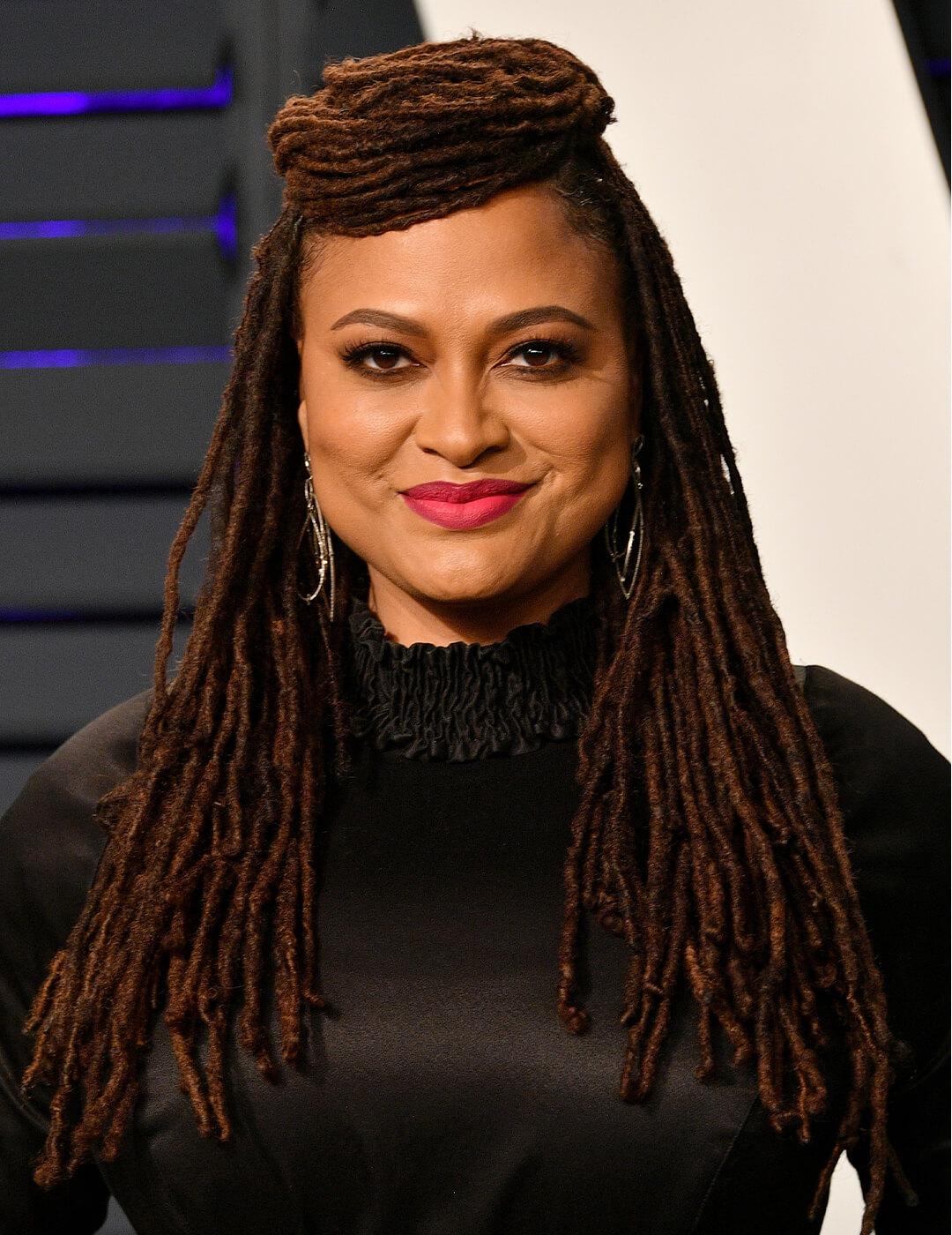 Ava DuVernay rocking her locs while smiling Mobile