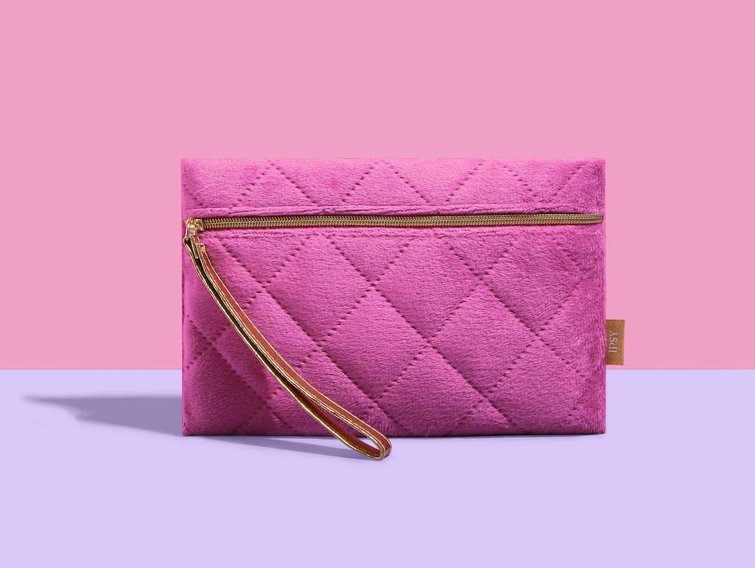 November 2023 IPSY Glam Bag on a purple and pink background Desktop