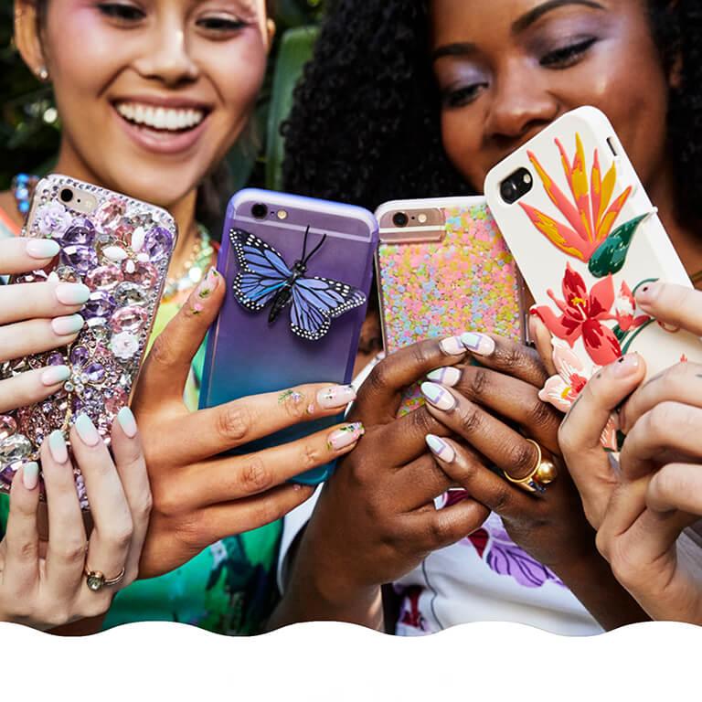 Ipsters hold up their patterned phone cases to show off their spring-inspired manicures. Mobile