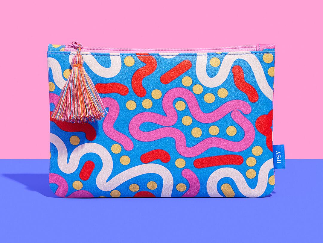 September 2023 IPSY Glam Bag on pink and blue background Desktop