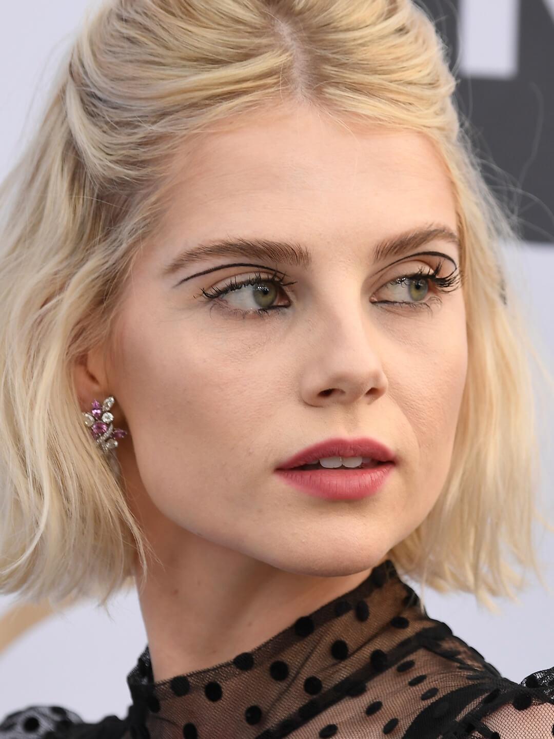 Close-up of Lucy Boynton rocking minimal face makeup and a floating eyeliner look Desktop