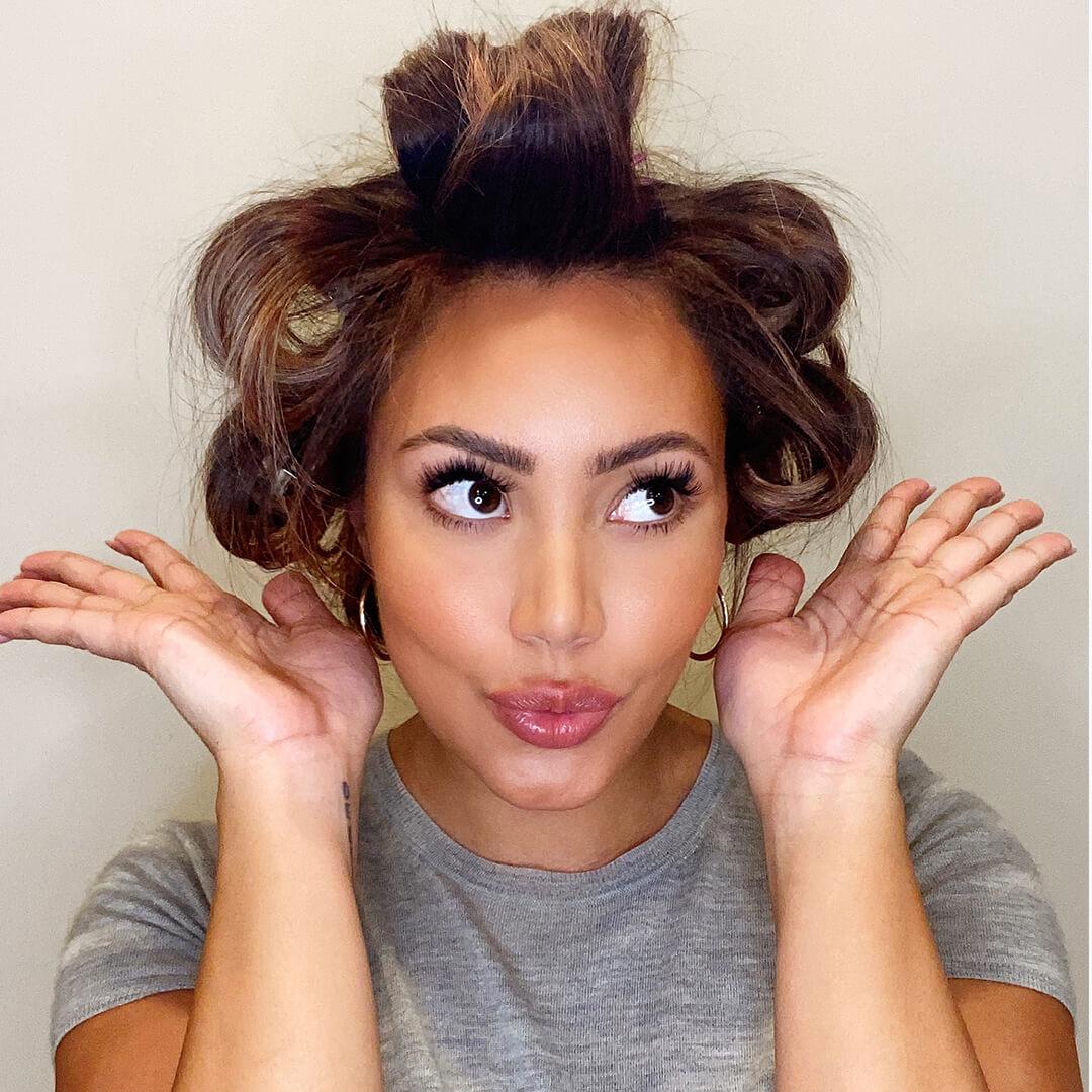 Close-up of Cynthia Alvarez with pinned hair sections posing Mobile