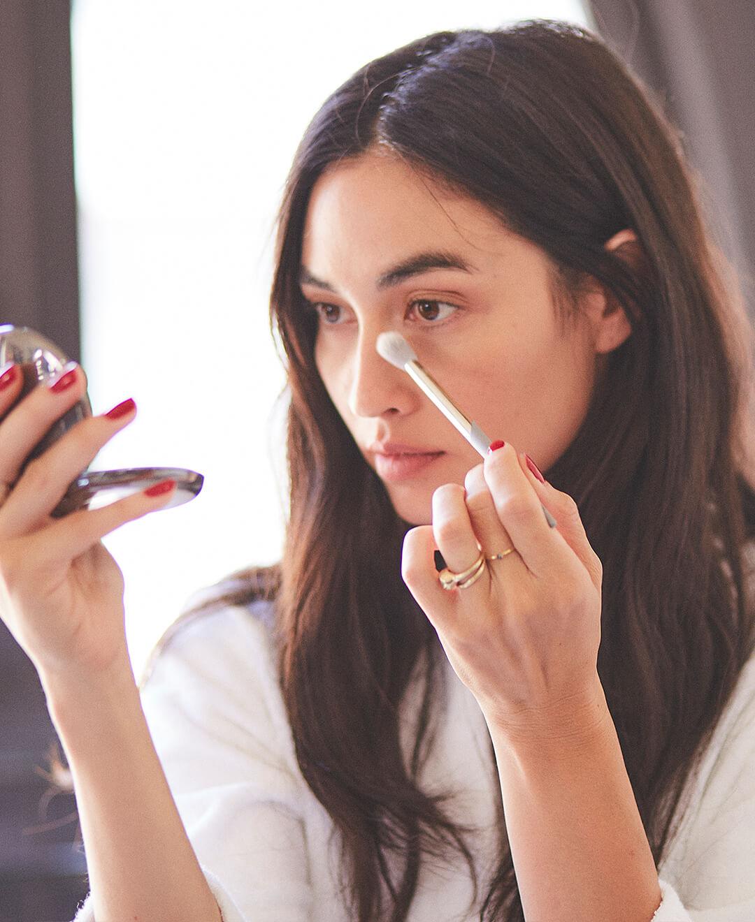 Young and beautiful model applying eye makeup using a COMPLEX CULTURE makeup brush Desktop