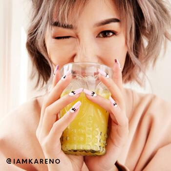 A model drinks a hydrating beverage. Mobile