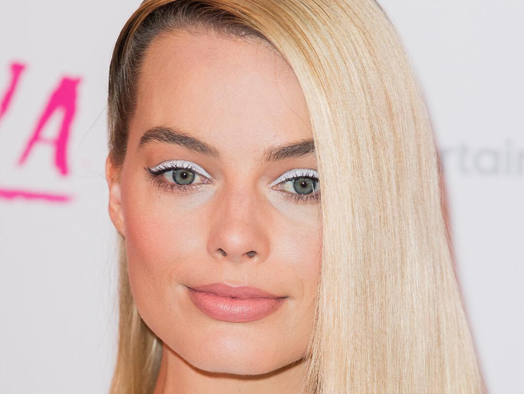 Close-up of Margot Robbie rocking a white eyeshadow look and side swept hairstyle Desktop